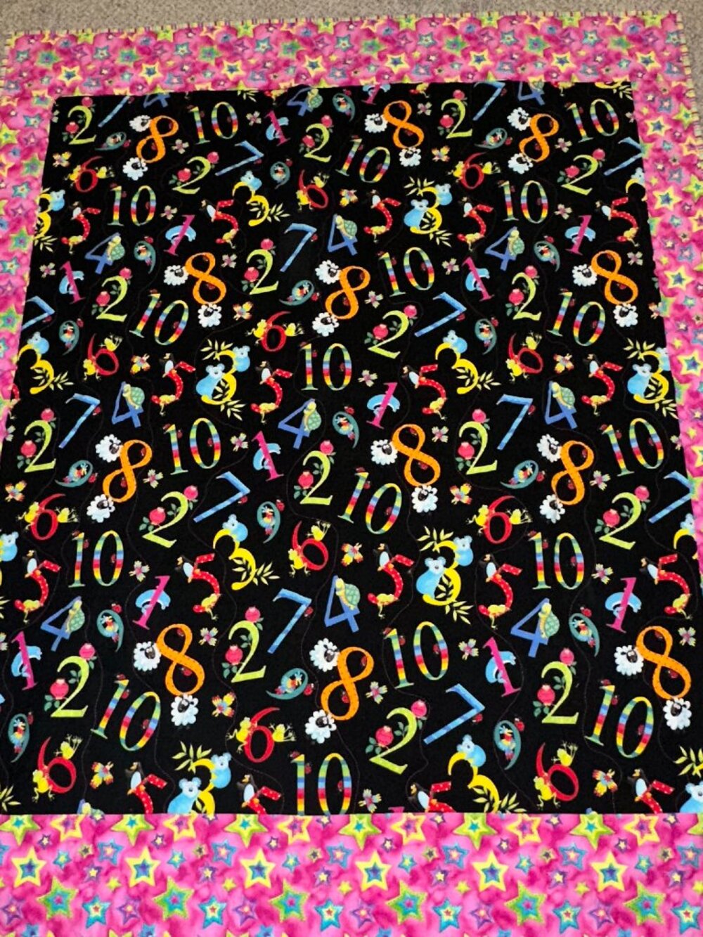 Handmade bright BABY QUILT featuring numbers fabric pink stars stripes blanket